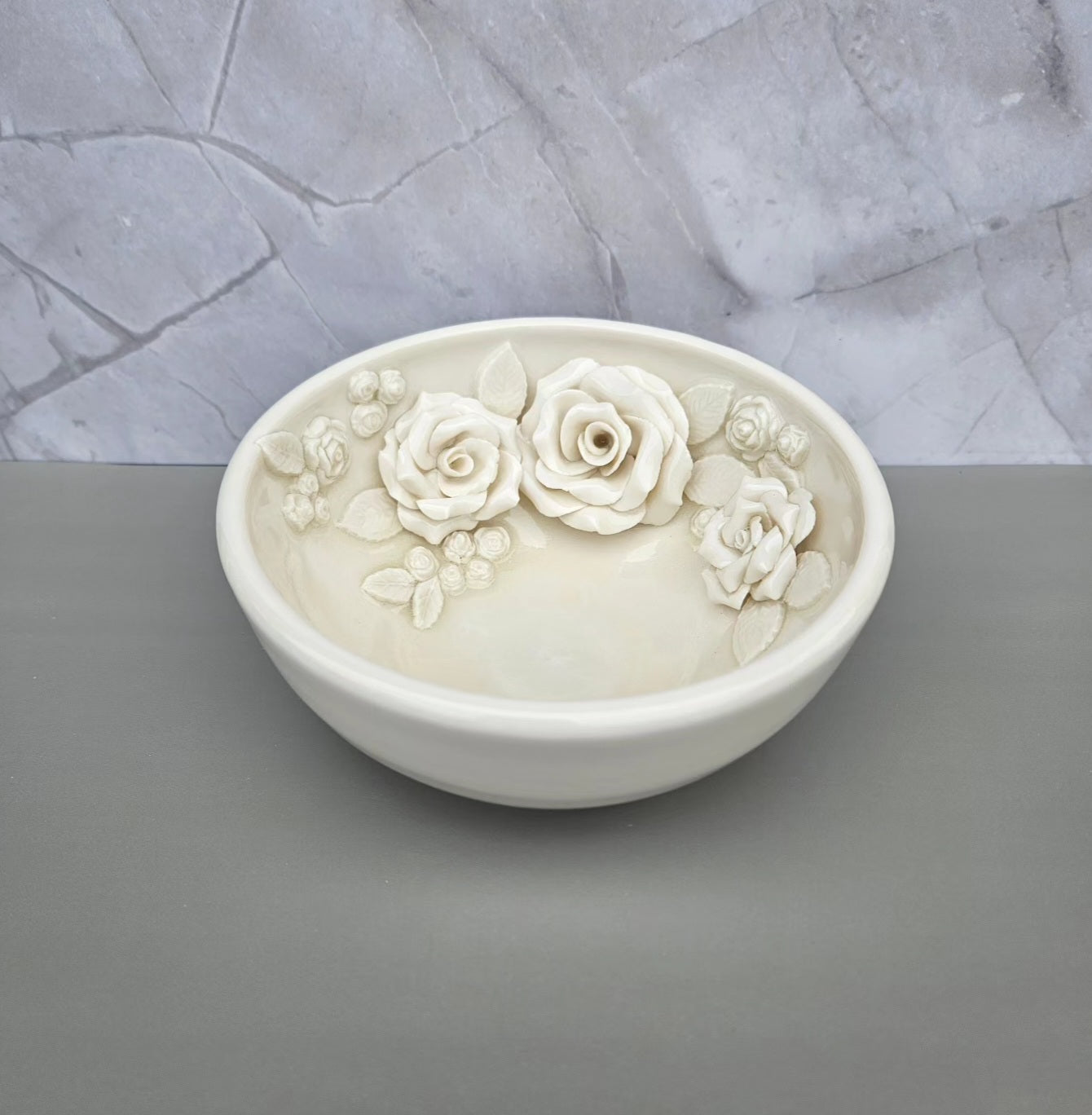 White frost shallow bowl with roses within the bowl. 6 inches wide, 3 inches deep.