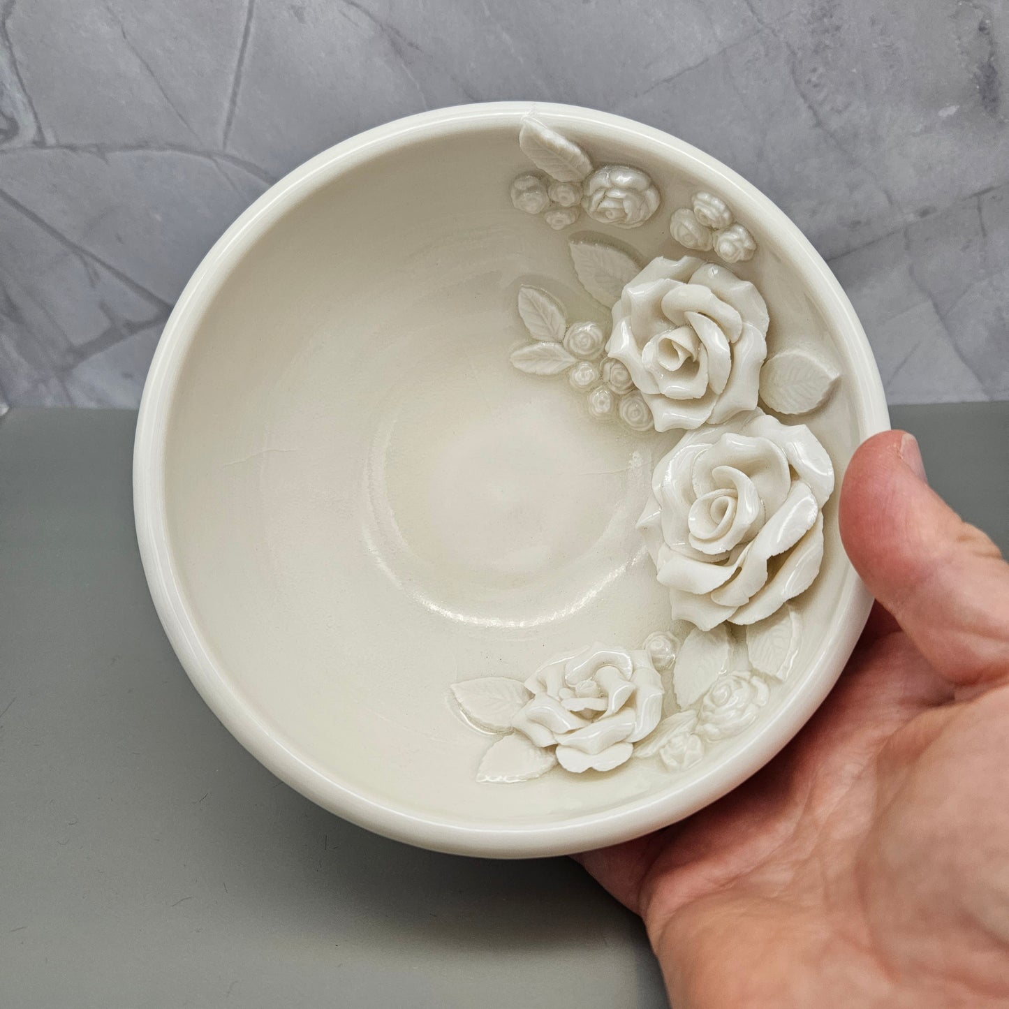 White frost shallow bowl with roses within the bowl. 6 inches wide, 3 inches deep.