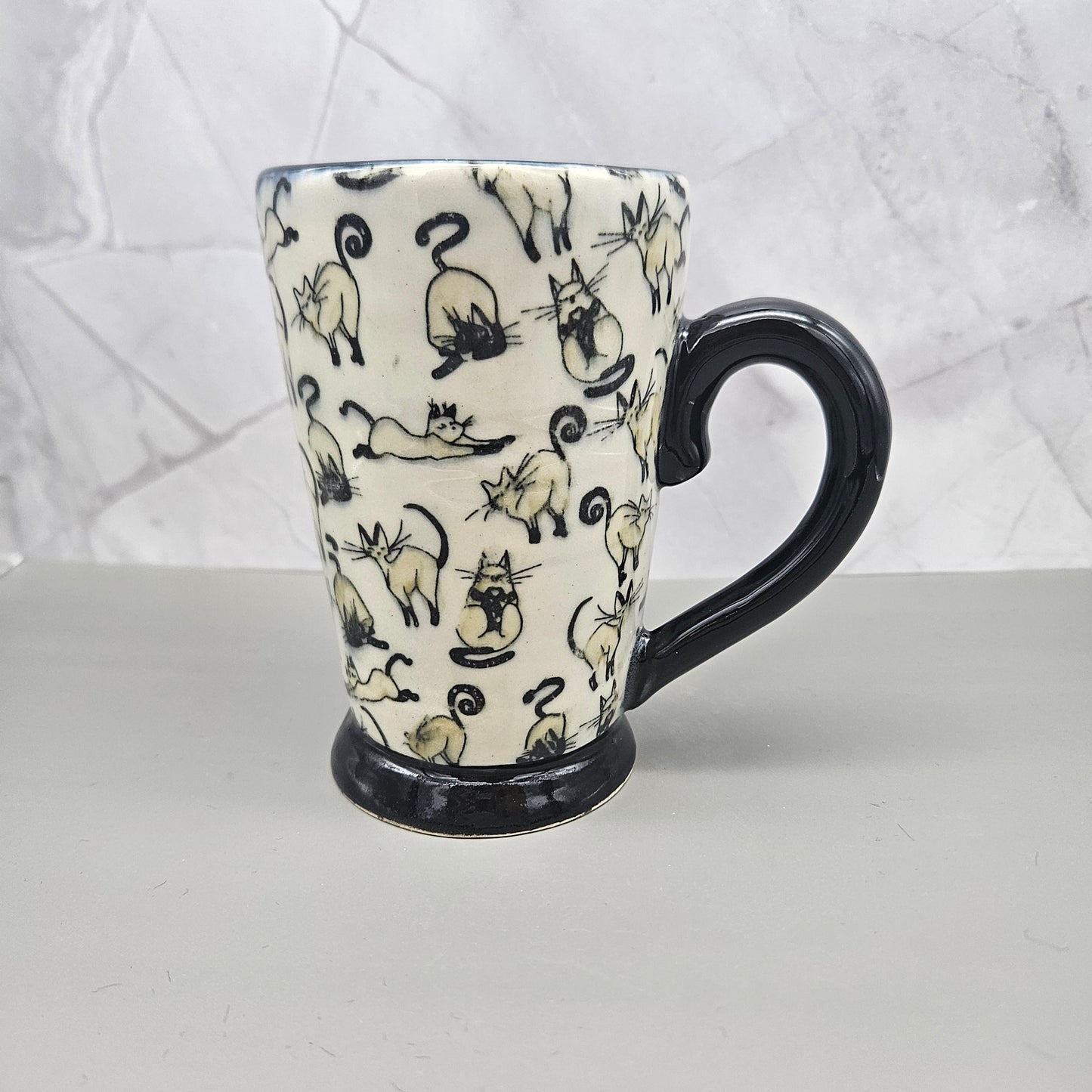 White and black mug with tan kitties, 12 oz.