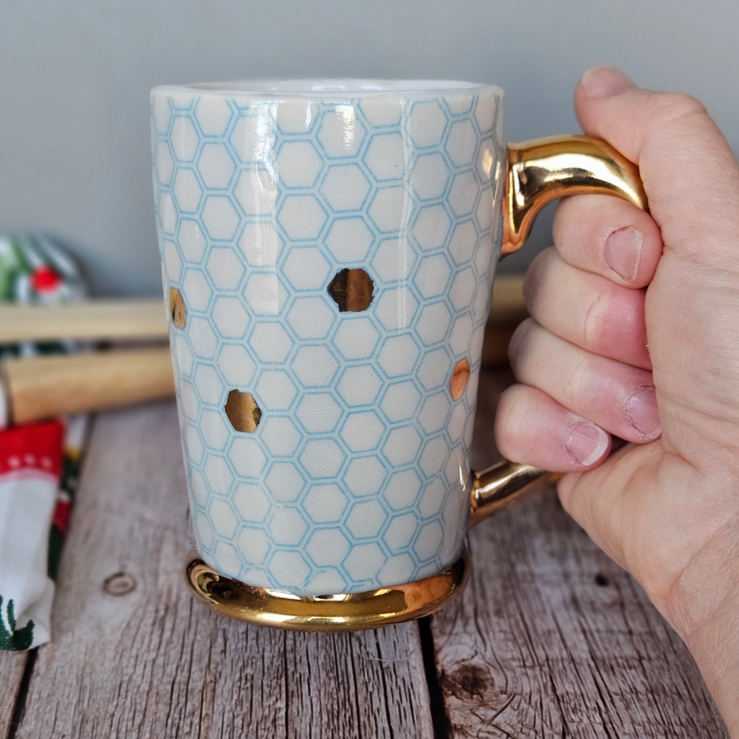 Blue and white honeycomb mug with 22k yellow gold handle, foot