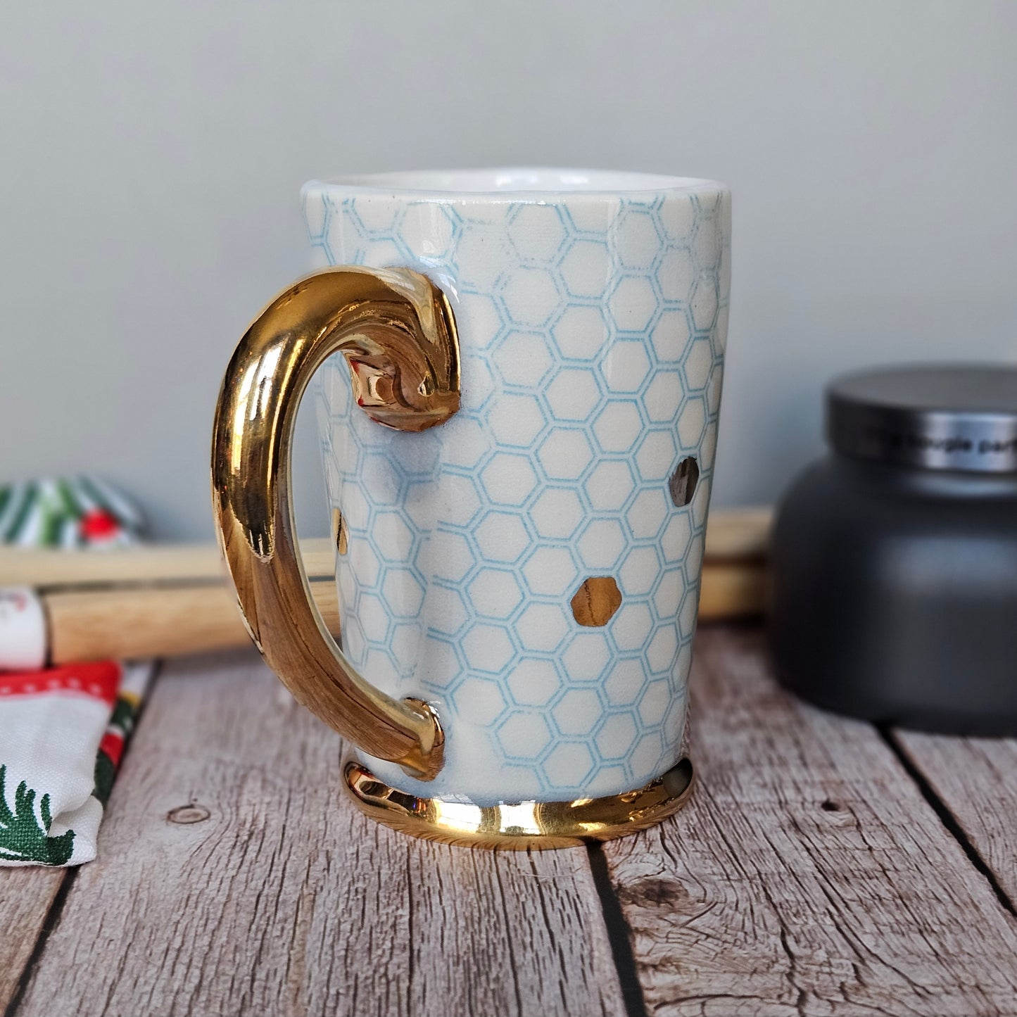 Blue and white honeycomb mug with 22k yellow gold handle, foot