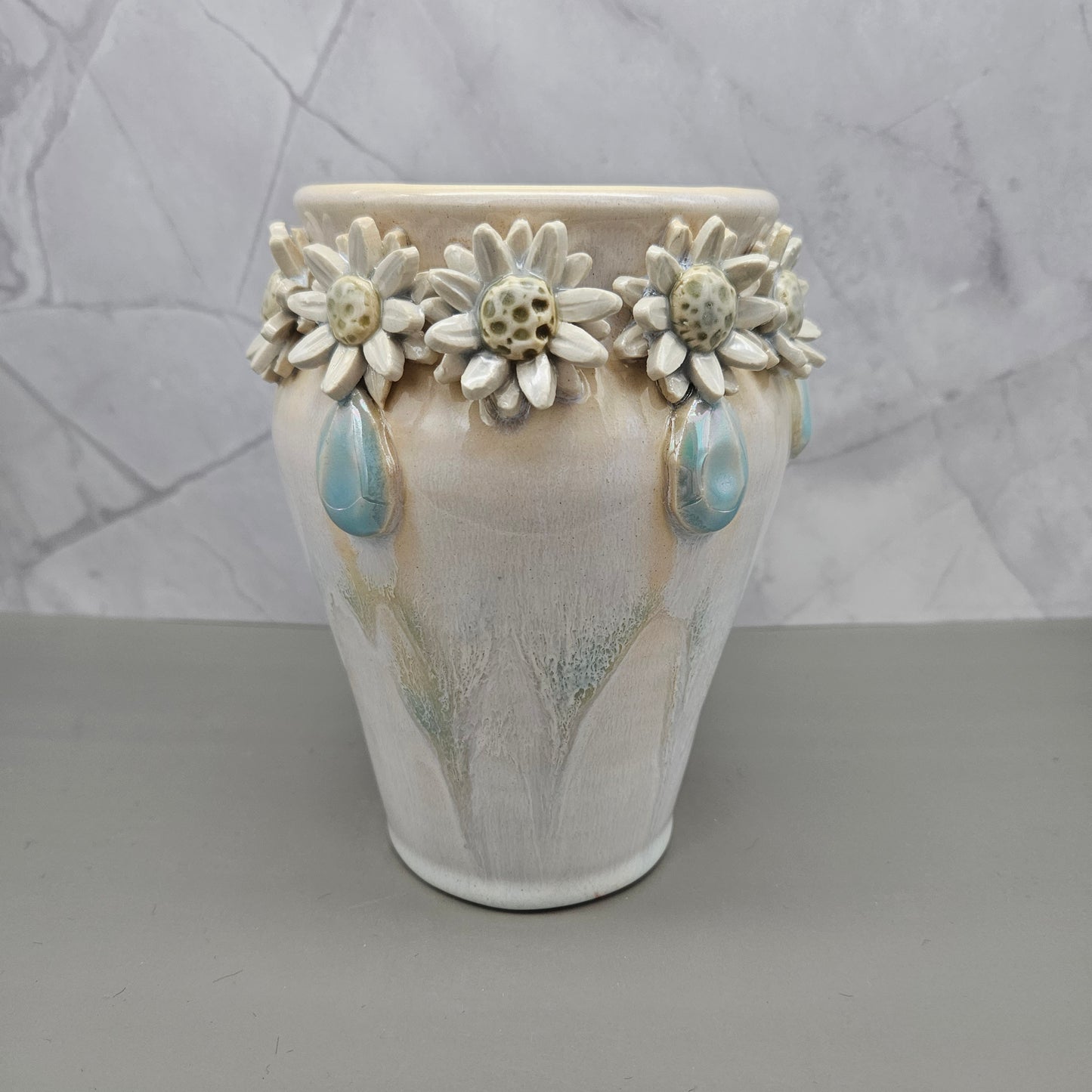 Light blue and white marbled vase with blue mother of pearl jewels