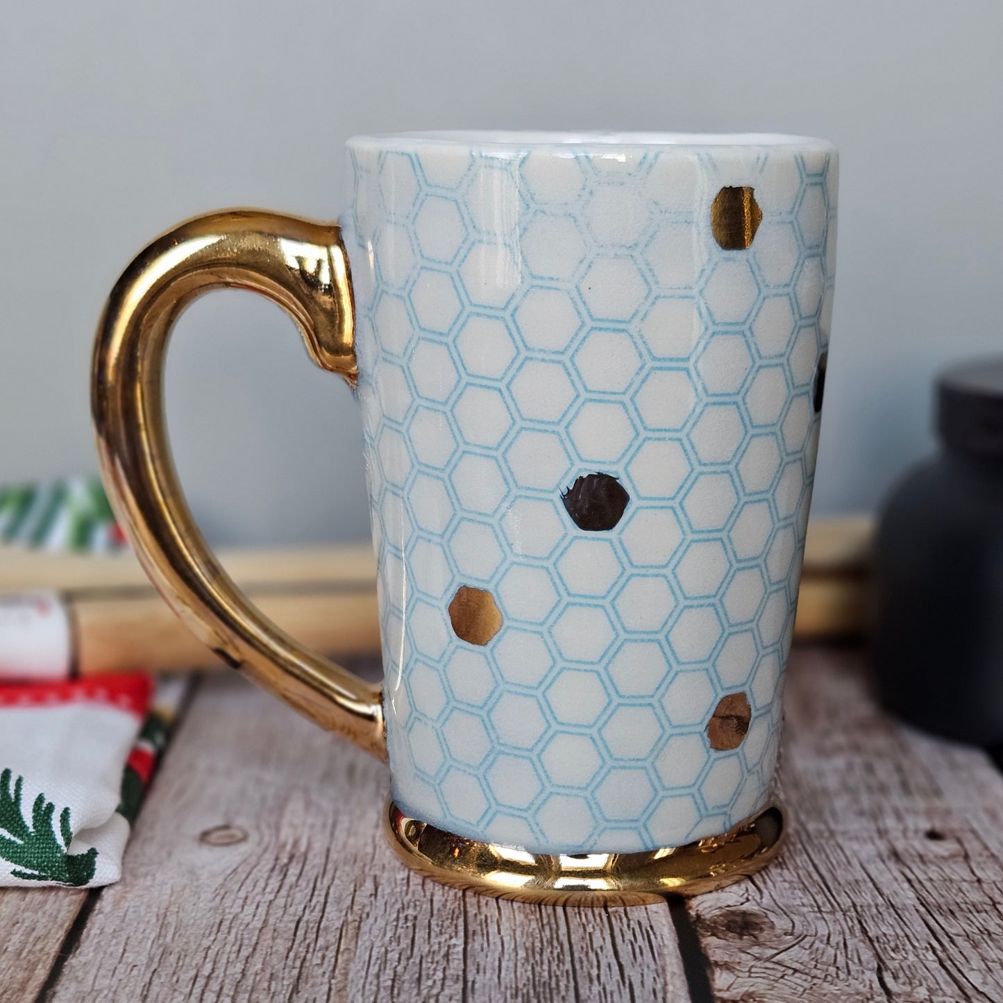 Blue and white honeycomb mug with 22k yellow gold handle, foot