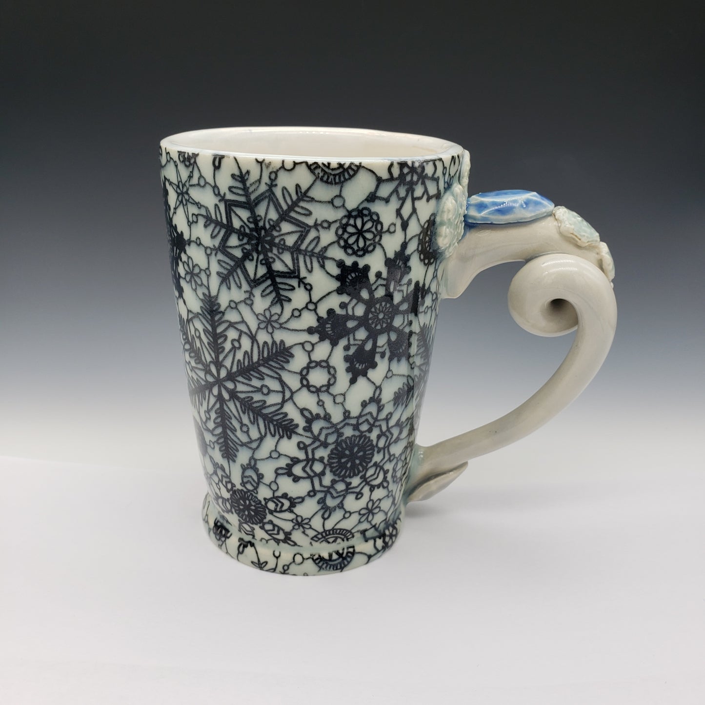 Light blue vintage lace snowflake mug with detailed twist handle
