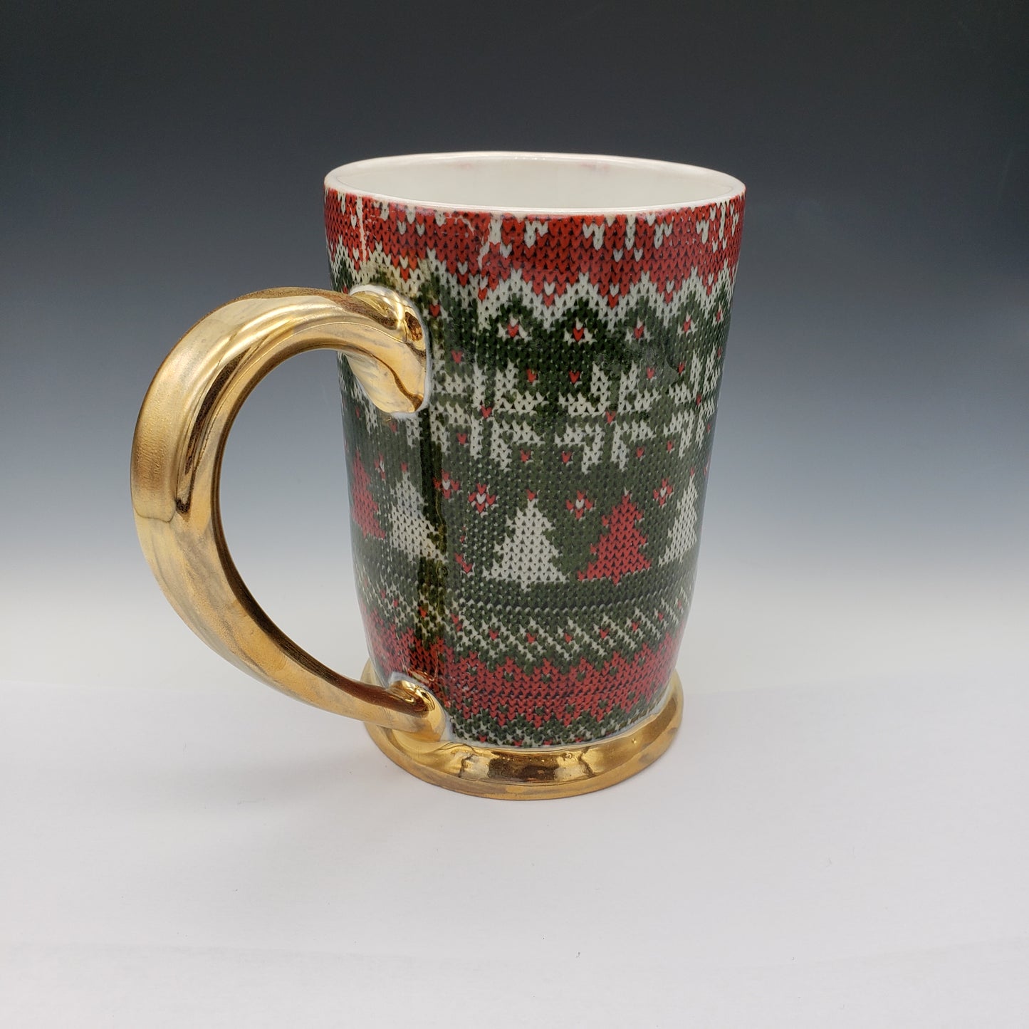 Red and green ugly sweater mug with 22k yellow gold handle and base