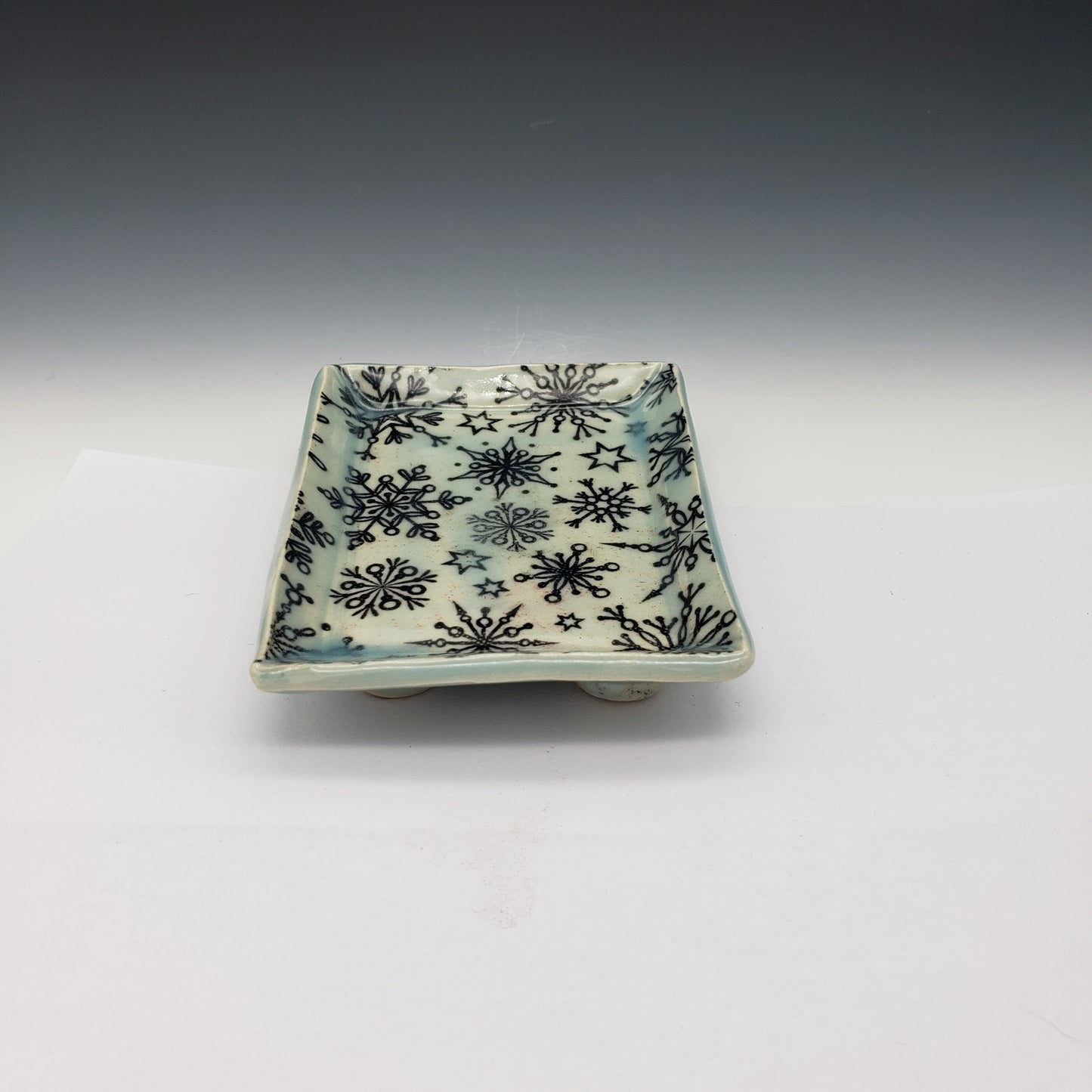 Various patterned 3 inch by 2 1/2 inch rectangle porcelain plates